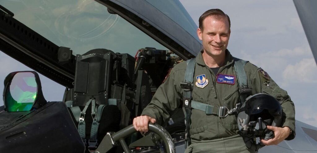 Test pilot Dan Daetz on the ladder of an F-22 Raptor